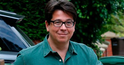 Smiling Michael McIntyre proudly shows off his new watch after 